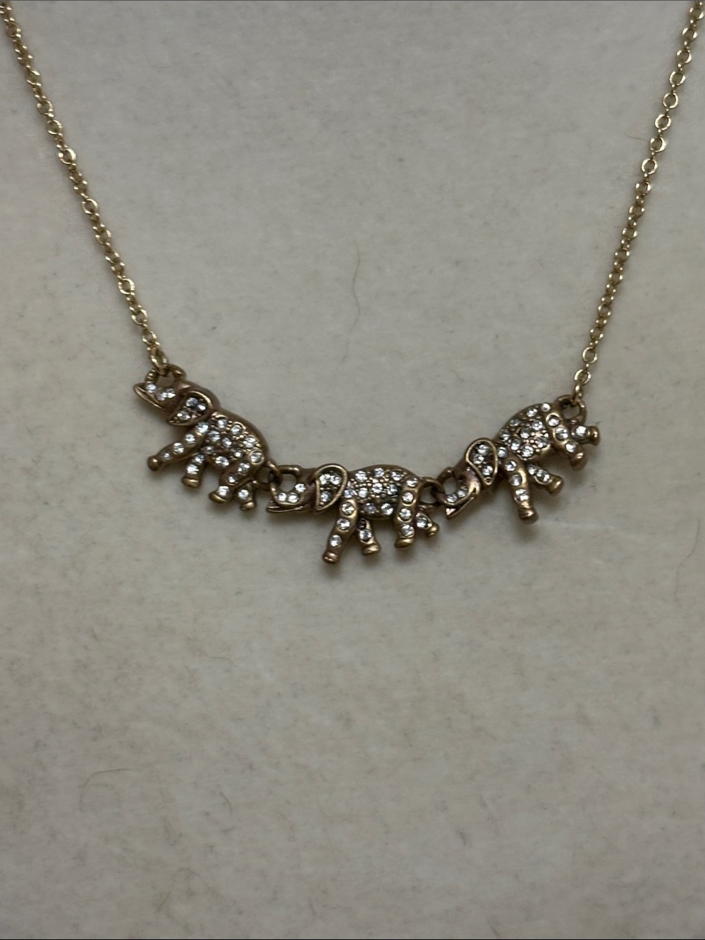 vintage J.Crew gold-tone rhinestone elephant trio necklace.